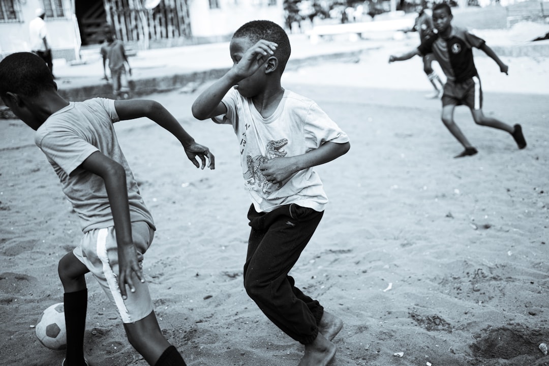 A group of young men playing a game of soccer