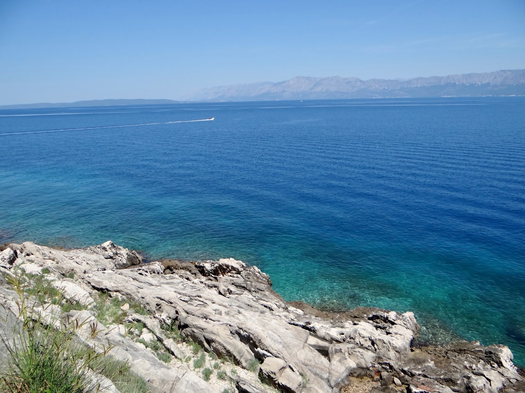 a body of water with a boat in the distance