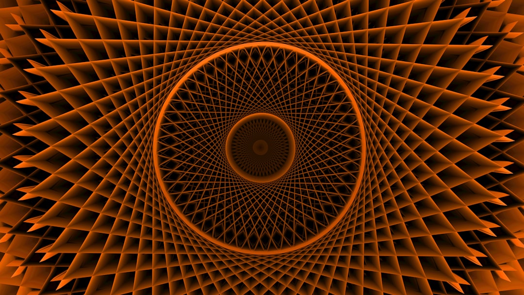 An orange spiral pattern creates an optical illusion.